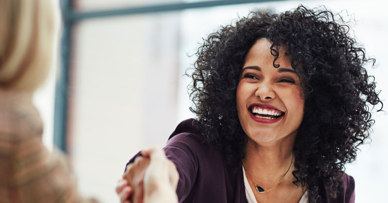 hiring manager greets new hire during employee onboarding process