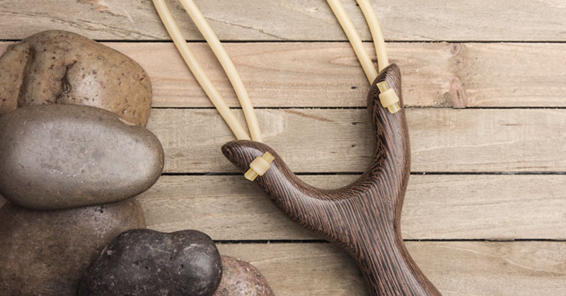 slingshot and rocks like David and Goliath HR superpower
