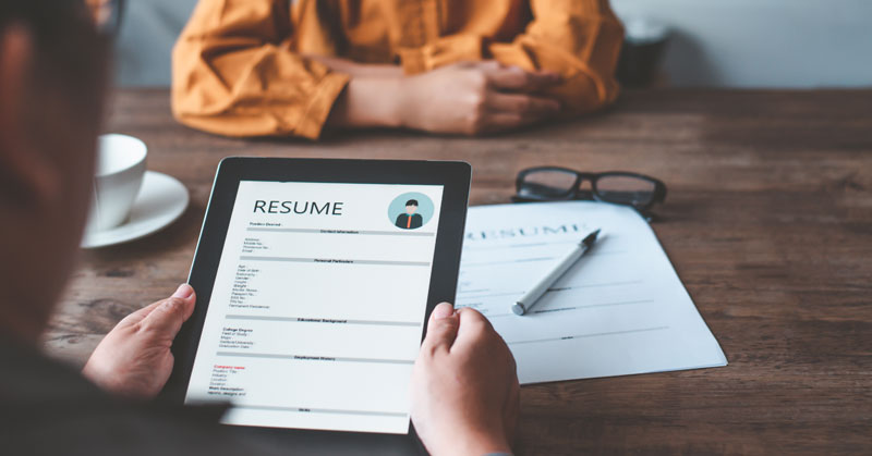 hr looking at resume for applicant for job