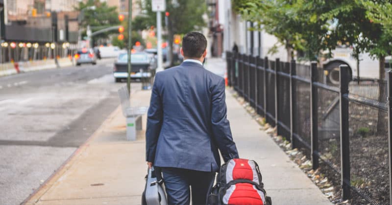employee moving with luggage